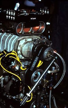 an engine is shown in this image with yellow hoses attached to the front end