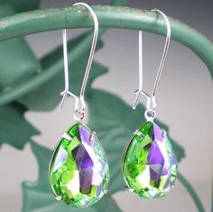 "Rhinestone earrings feature green purple (similar to glacier blue) 18x13mm pear (teardrop) rhinestones  set in silvertone metal settings. Stones dangle from (lead and nickel free) silver plated kidney wires and measure 1 1/2\" long.  Perfect for wedding & bridesmaid jewelry! Need more than one? Convo me and I would be happy to set up a custom listing just for you! Be sure to see the matching necklace & coordinating earrings: https://www.etsy.com/listing/463024855/green-purple-rhinestone-necklac Drop Earrings Wedding, Wedding Earrings Drop, Wedding Party Gift, Wedding Bridesmaid Jewelry, Jewelry Bridesmaid, Purple Rhinestone, Wedding Bridesmaid, Green Gifts, Earrings Wedding