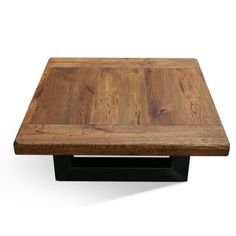 a square wooden table with black metal legs