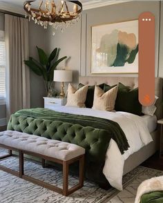 a bedroom with a large bed and green velvet upholstered pillows on the headboard