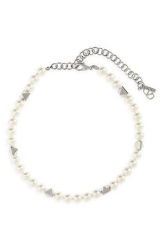 A dainty VLOGO charm based on an archival '70s motif dangles from this choker necklace strung with pyramidal beads and Swarovski imitation pearls. 13" length; 4" extender Pearls: 8mm Lobster clasp closure Brass/Swarovski imitation pearl Made in Italy White Formal Jewelry With Logo Charm, Formal White Jewelry With Logo Charm, Valentine's Day Pearl Clavicle Chain Necklace, Valentino Pearl Necklace, Delicate Pearl Charm Choker, Pearl White Choker With Pearl Charm, Luxury Pearl Chain Choker, Mens Jewelry Necklace, Pearl Choker Necklace