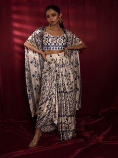 A three-piece Moroccan print set from the Juhi Bengani collection. This elegant Dhoti Skirt is paired with a satin georgette corset. The outfit is completed with a matching satin georgette cape. Dhoti Skirt, Cape Set, Moroccan Print, Western Dresses For Women, Trendy Outfits Indian, Tandoori Masala, Indo Western Dress, Ethnic Outfits, Party Wear Indian Dresses