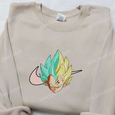 a sweatshirt with the image of gohan from dragon ball is shown in front of a white background