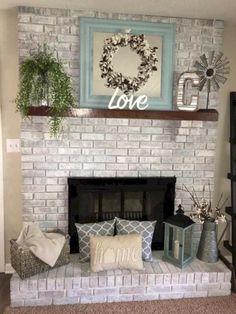 a living room with a brick fireplace and some decorations on top of the mantel