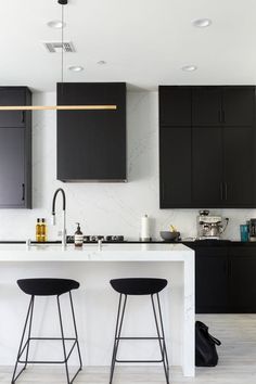 black and white kitchen with bar stools