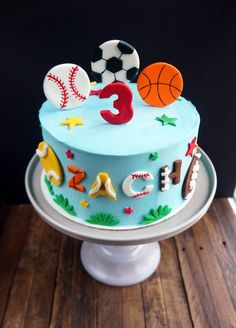 a birthday cake decorated with sports related items