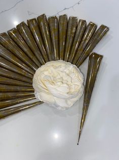 a white flower sitting on top of a table