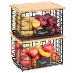 two metal baskets filled with fruits and vegetables