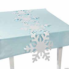 a snowflake tablecloth with white snow flakes on it