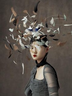 a woman with birds flying around her head