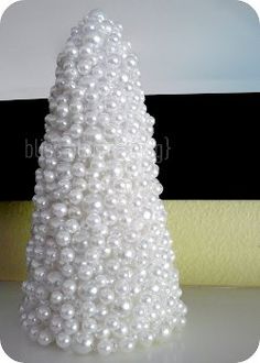 a white christmas tree made out of pearls