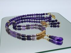 Handmade Beautiful and Elegant Necklace and Earrings Set. Made with Natural Amethyst (8mm, 9x11mm) Beads and High-Quality long-lasting 24K Gold plated findings.  Clasp encrusted with Austrian Cubic Zirconia Crystals.  Pendant length: 35mm/1.5in Necklace length: 59cm/23in Perfect for any occasion, Weddings and Parties or as a gift for Valentines Day, Birthday, Anniversary. Perfect as a gift for a friend or a treat for yourself! All of my jewellery is handmade, by me.  Every item is made personally with each one taking several hours of painstaking work.  Each item is made carefully with great attention to detail to ensure the highest possible quality. Feel free to contact me at any time if you have questions. Also, I have other items for sale in my Etsy shop and own - larajolycraft.com Shoul Elegant Gold Jewelry Sets With Natural Stones, Elegant Gold Jewelry Sets With Gemstone Beads, Gold Amethyst Jewelry With Gemstone Beads, Amethyst Gold Jewelry With Gemstone Beads, Luxury Amethyst Gemstone Beads Jewelry, Formal Amethyst Multi-stone Necklace, Gift Ideas Jewelry, Luxury Multi-stone Amethyst Necklace, Crystals Pendant