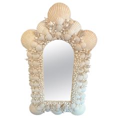 a mirror that has shells on it