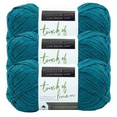 three balls of blue yarn with the words touch of touch of fine written on them