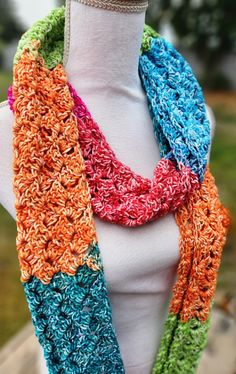 Soft and cozy, this bright and colorful scarf will keep you warm and cheerful even on the coolest fall day. Warm Multicolor One-size Scarves, Multicolor Scarves For Cold Weather In Fall, Cozy Multicolor Scarves For Cold Weather, Warm Multicolor Scarves For Fall, Warm Casual Multicolor Scarves, Casual Multicolor One-size Infinity Scarf, Warm Multicolor Casual Scarves, Casual Multicolor One Size Infinity Scarf, Casual Warm Multicolor Scarves