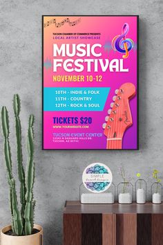 the music festival poster is displayed next to a cactus and potted cacti