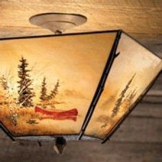 a ceiling light with a painting on it