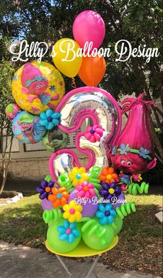 balloons are in the shape of numbers and flowers