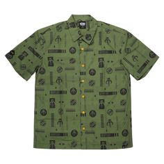 a green button up shirt with black and white images on the front, in an allover pattern