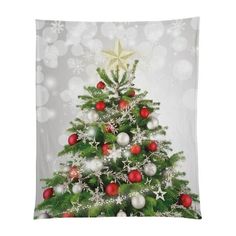 a christmas tree with red and white ornaments is featured on a wall hanging from the ceiling