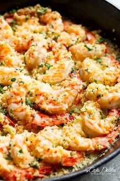 a skillet filled with shrimp and rice