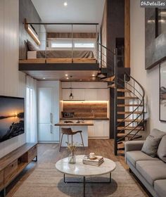 a living room filled with furniture and a spiral staircase