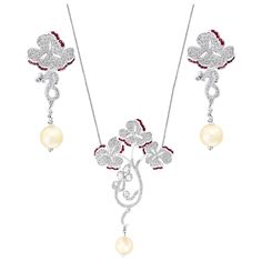 This Suite made out of 18 Karat white gold .It is consisting of 3 natural Pearls and Rubies . There are Invisible set natural Burma Rubies. Total weight of Rubies is approximately 1 ct. The set has approximately 4.5 carats of round brilliant cut Diamonds. Necklace comes with matching post earrings . Necklace also have 4 big Rose cut solitaire diamonds. 18 Karat gold 35 grams Please look at all the pictures Its very hard to capture the true color and luster of the stone, I have tried to add pictu Luxury White Gold Jewelry Sets With Elegant Design, Luxury Sterling Silver Jewelry Sets, Luxury White Gold Jewelry Sets For Anniversary, Luxury White Gold Sterling Silver Jewelry Sets, White Gold Diamond Jewelry Set With Matching Earrings, Elegant White Gemstone Jewelry Sets, Exquisite White Gold Sterling Silver Jewelry Sets, Luxury White Jewelry Sets Hand Set, Luxury White Hand Set Jewelry Sets