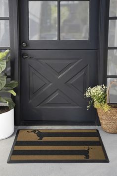 the front door is decorated with black and gold stripes