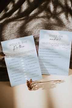 two sheets of paper sitting on top of a bed next to each other with writing on them