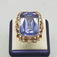 "Vintage 14K Yellow Gold with a Synthetic 25 Carat Color Changing Sapphire Ring, Size 8.75. Marked 585 inside band. Stone is 19 x 14mm. Ring is 26mm wide. Weighs 8.0 dwt. We do not check prongs for wear or stones for looseness. All items are sold AS IS, noting that we are a resale shop so everything here had a previous owner! We will include flaws in the description when noted. This is one of the reasons our items are more affordable than new at a jewelry store. Are these stones real or fake? As Heirloom Yellow Gold Sapphire Ring Collectible, Luxury Vintage Sapphire Ring With Polished Finish, Luxury Yellow Sapphire Ring With Polished Finish, Luxury Faceted Yellow Gold Sapphire Ring, Antique Gold Sapphire Ring Collectible, Vintage Yellow Gold Sapphire Jewelry, Oval Cabochon, Color Change Sapphire, European Jewelry, Vintage Fine Jewelry