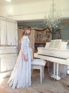 "Lovely cotton print dress from the 1860s. This dress has many wounds and repairs. I made a new cotton lining for the shoulder parts because the fabric was weak.  Also the old print (seed pattern) got so many holes, that I have to say: this dress is not wearable. Both sleeves have piping at the shoulders, and in the waist you see many pleads.  The bodice has a very small cotton lining, and this one has dark spots.But these are not visible while wearing or exposing. The dress has some of oxygen staining too. I tried to give the dress a longer life and I put little fabrics behind the holes of the print.  I also found 10 very little antique fabric buttons to complete this lovely dress. Measurements: Bust 80 cm  31.5\"  Waist 63 cm  24 3/4\". Total length 142 cm  56 inches at the front, 152 cm Vintage Beige Cotton Prairie Dress, Old Dresses Vintage, 1860s Fashion, Old Dress, Calico Dress, 1860s Dresses, Fur Dress, White Flower Dress, Old Dresses