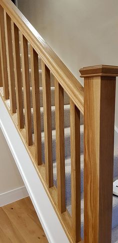 the stairs are made of wood and have handrails