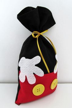 a black bag with white and red designs on it