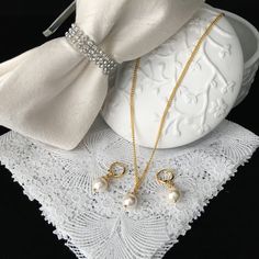 "Simple and elegant, timeless and elegant. Pearls are simply a girl's best friend.   The earrings are handcrafted using high quality glass pearls, 18 kt gold plated hoop earring findings with lever backs and 18 kt gold plated floral bead caps. The pearls are .38\" or .96 cm in diameter. The earring measure 1.25\" or 3.175 cm from the top of the earring and the drop is .58\" or 1.47 cm, The coordinating pendant is on an 18\" or 45.72 cm gold plated chain." Pearl Earrings And Necklace, Earring And Necklace Set, Earrings And Necklace, Pearl Earring, Necklace Pearl, Earring Findings, Bead Caps, Gold Plated Chains, Girls Best Friend