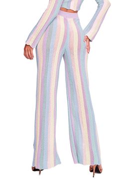 Colorful stripes enhance the breezy vibe of these kick-flare cover-up pants designed with a ribbed waist and a drawstring closure. Drawstring waist 100% acrylic Hand wash, dry flat Made in Peru Hispanic & Latinx Owned/Founded Spring Striped Flare Bottoms, Spring Flare Striped Bottoms, Striped Flare Bottoms For Spring, Chic Striped Wide Leg Pants For Beach, Crochet Collection, Crochet Cover Up, Kick Flares, Pants Design, Paloma