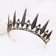 Bossy Black Diamond & Gold Tiara Crown FIT FOR A QUEEN This royally bossy crown has wicked and stunning graduating 3-inch spikes adorned with dazzling crystal diamonds that command attention. Giving you a stunning eye-catching look. Tiara Headpieces, Birthday Tiara, Bride Crown, Women Bride, Rhinestone Tiara, Black Crown, Black Bride, Queen Crown, Crystal Tiaras