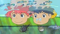 two children looking at fish in the water