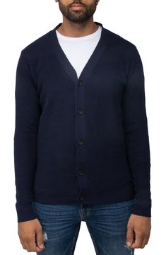 Start adding layers to your wardrobe as the weather cools down. Button up this sweater cardigan for a put-together and preppy look or leave it open to keep things casual. Fit: this style fits true to size. 29" length (size L) V-neck Long sleeves Front button closure 100% cotton Dry clean only Imported Navy Preppy Sweater For Fall, Casual Cardigan With Button Closure For Layering, Casual V-neck Sweater For Winter Workwear, Casual Navy Sweater With Buttons, Winter Cotton Cardigan With Buttons, Navy Sweater For Winter Layering, Navy Cotton Cardigan For Fall, Navy Casual Sweater For Layering, Navy Sweater For Layering In Fall