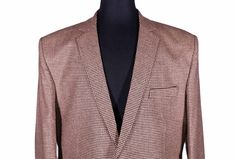 This Chiragh Apparel blazer is an elegant upgrade on dapper tailoring and features rich shades in a sumptuous fabric for elegant opulence. Fashioned from 100% premium quality wool, this houndstooth check blazer features full lining in Japanese silk, a notch lapel, two-button closure and single vented back. A left chest pocket and three flap pockets appoint the front while the inside has two (2) pockets on the left and one (1) pocket on the right. A flash of contrast piping is added to the jacket Tailored Houndstooth Tweed Jacket For Business, Business Blazer With Notch Lapel And Houndstooth Pattern, Tailored Business Blazer With Houndstooth Pattern, Business Tweed Jacket With Houndstooth Pattern And Suit Collar, Semi-formal Houndstooth Outerwear With Notch Lapel, Semi-formal Houndstooth Notch Lapel Outerwear, Formal Houndstooth Tweed Jacket With Notch Lapel, Formal Houndstooth Pattern Outerwear With Suit Collar, Formal Outerwear With Houndstooth Pattern And Suit Collar