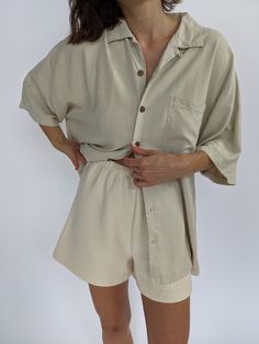 Sweet sand woven silk button up with a collared neckline short sleeves and faux front wooden button closures. Tag reads Tommy Bahama Silk Button Up, Knit Outerwear, Line Shopping, Linen Shop, Dress Suits, Shop Swimwear, Vintage Cotton, Knit Cotton, Raw Silk