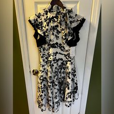 Nwt Mikael Aghal Asymmetrical Black And White Dress Fully Lined Size 6 Beautifully Lined Never Worn Elegant Asymmetrical Dress With Floral Print For Party, Elegant Fitted Asymmetrical Dress With Floral Print, Elegant Asymmetrical Dress With Floral Print, Elegant Sleeveless Asymmetrical Dress With Floral Print, Evening Floral Print Midi Dress With Asymmetrical Hem, White Asymmetrical Dress With Floral Print, Elegant Asymmetrical Midi Dress With Floral Print, Elegant Asymmetrical Floral Print Midi Dress, White Asymmetrical Evening Dress For Spring