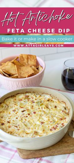 a close up of a pizza in a pan on a table with chips and wine