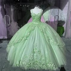 Green Quinceanera Dresses Princess And The Frog, Quinceanera Dress Sage Green, Green Dress For Sweet 16, Light Green Sweet Sixteen Dress, Tiana Theme Quinceanera, Light Green Poofy Dress, Green Floral Quinceanera Dresses, Quencinera Dresses Green, Sage Green And Lavender Quinceanera Dress