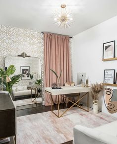 a living room filled with furniture and a large mirror on top of a wall next to a window