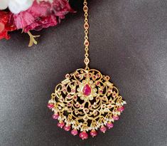 Featuring a large edwardian era inspired jadau maang teeka in 22k gold plateds sterling silver,set with precious freshwater pearls and synthetic stones that resemble rubies. The beads in hangings are real rubies and pearls. The teeka weighs 16gms and the chain length is 8.5cms with a hook at the top All our Gold Plated Jewellery is made using 925 Silver as the base metal. The beads in hanging and strings (like in our 22k gold jewelry) are always precious freshwater pearls and high quality ruby, Ceremonial Kundan Necklace With Ruby And Intricate Design, Traditional Red Kundan Necklace In 22k Gold, Yellow Gold Kundan Necklace With Ruby For Wedding, 22k Gold Jewelry Necklaces, 22k Gold Jewelry, Pearl Necklace Set, Gold Jewelry Necklace, Emerald Necklace, Edwardian Era