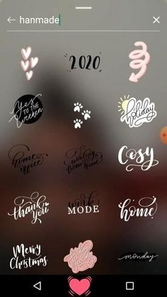 some stickers on the screen of a cell phone that is showing different types of lettering