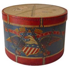 an american flag drum with eagle emblems and chains on the bottom, painted red white and blue