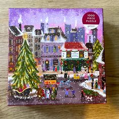 a puzzle box with a christmas scene on it