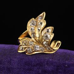 Beautiful Antique Victorian 22K Yellow Gold Old Mine Floral Leaf Ring. This gorgeous Victorian old mine diamond ring is crafted in 22k yellow gold. The ring features chunky old mine and peruzzi cut diamonds set in a rich 22k yellow gold mounting that has a leaf design. The ring is in good condition and sits low on the finger. Item #R1999 Metal: 22K Yellow Gold Weight: 5 Grams  Size: 6 1/2 Diamonds: Approximately 1.20 cts Color: J Clarity: SI2 Measurements: Top of the ring measures 21 mm wide and band measures 2.02 mm wide. Measurements off the finger: 4.4 mm high Layaway: For your convenience, we will be happy to provide layaway payment options. Please contact us to work out a layaway plan which best suits your needs. All layaway purchases are final sale. All domestic and international shi Antique 22k Gold Wedding Ring, Luxury Gold Diamond Ring With Rose Cut, Luxury Gold Diamond Ring With Rose Cut Diamonds, Vintage 22k Gold Wedding Rings, Antique 22k Gold Jewelry For Anniversary, Luxury Gold Cluster Ring With Rose Cut Diamonds, Victorian Gold Diamond Wedding Ring, Vintage 22k Gold Jewelry For Anniversary, Gold Cluster Ring With 17 Diamonds