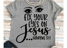 a t - shirt with the words fix your eyes on jesus and an eyeball